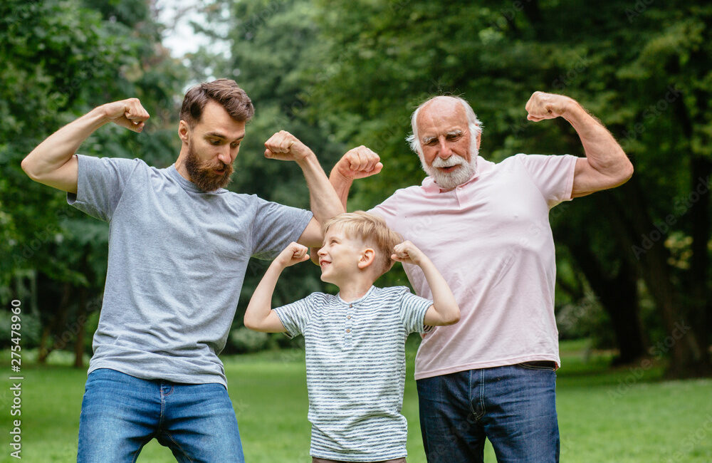 3 generations of men in strong man flex